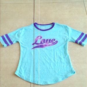 A long sleeve tee that is a size M in girls